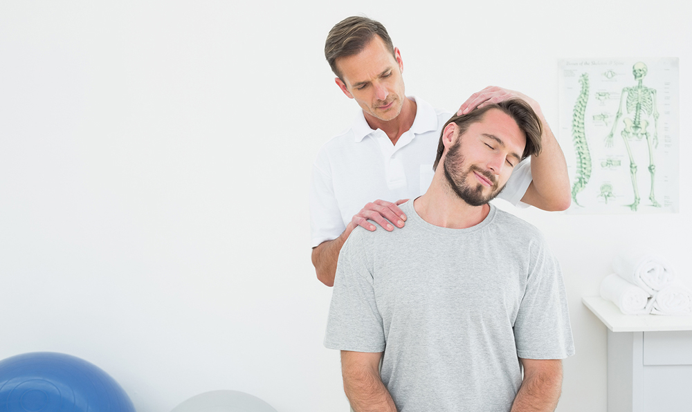patient with chiropractor receiving an adjustment for neck pain